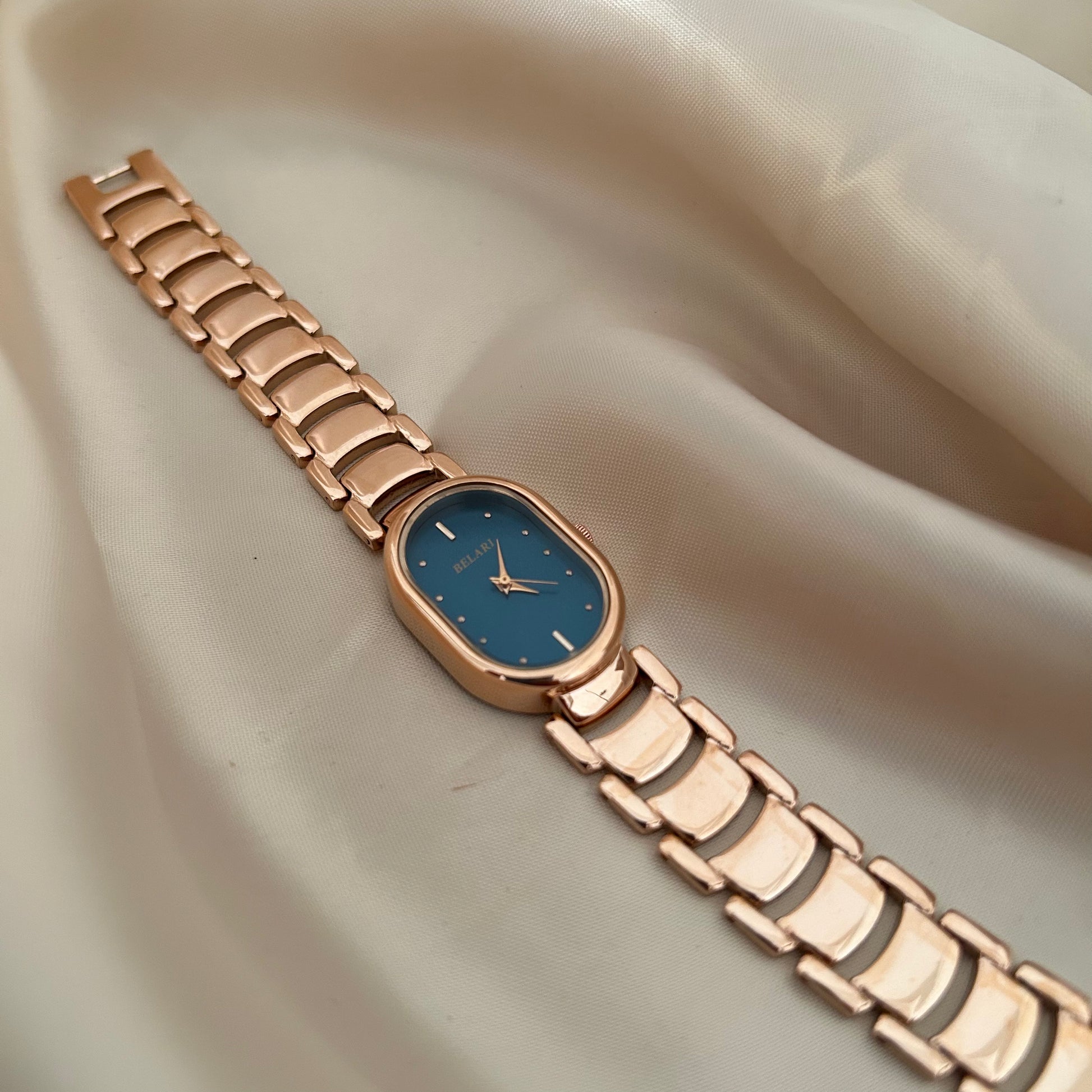 Slim rose gold watch with a delicate oval dial offering a feminine and graceful everyday style.