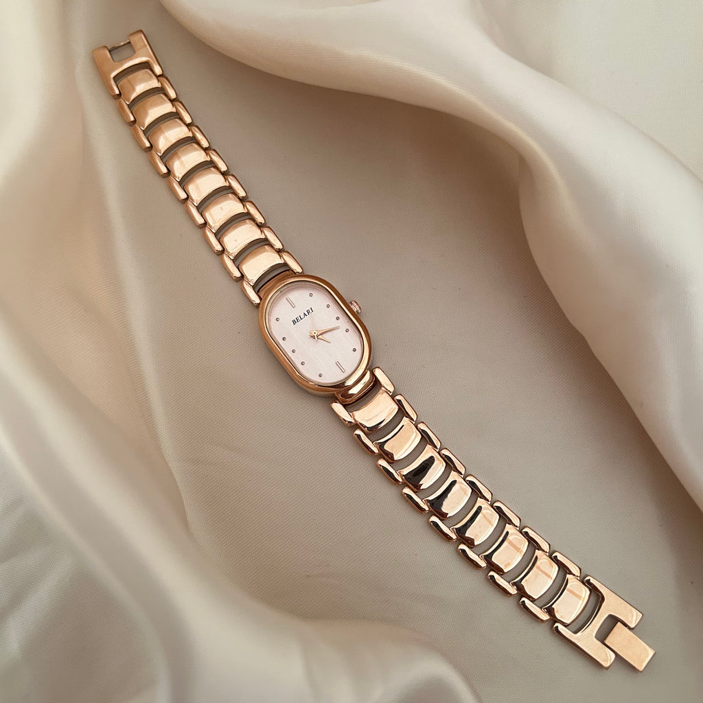Slim rose gold watch with a delicate oval dial offering a feminine and graceful everyday style.