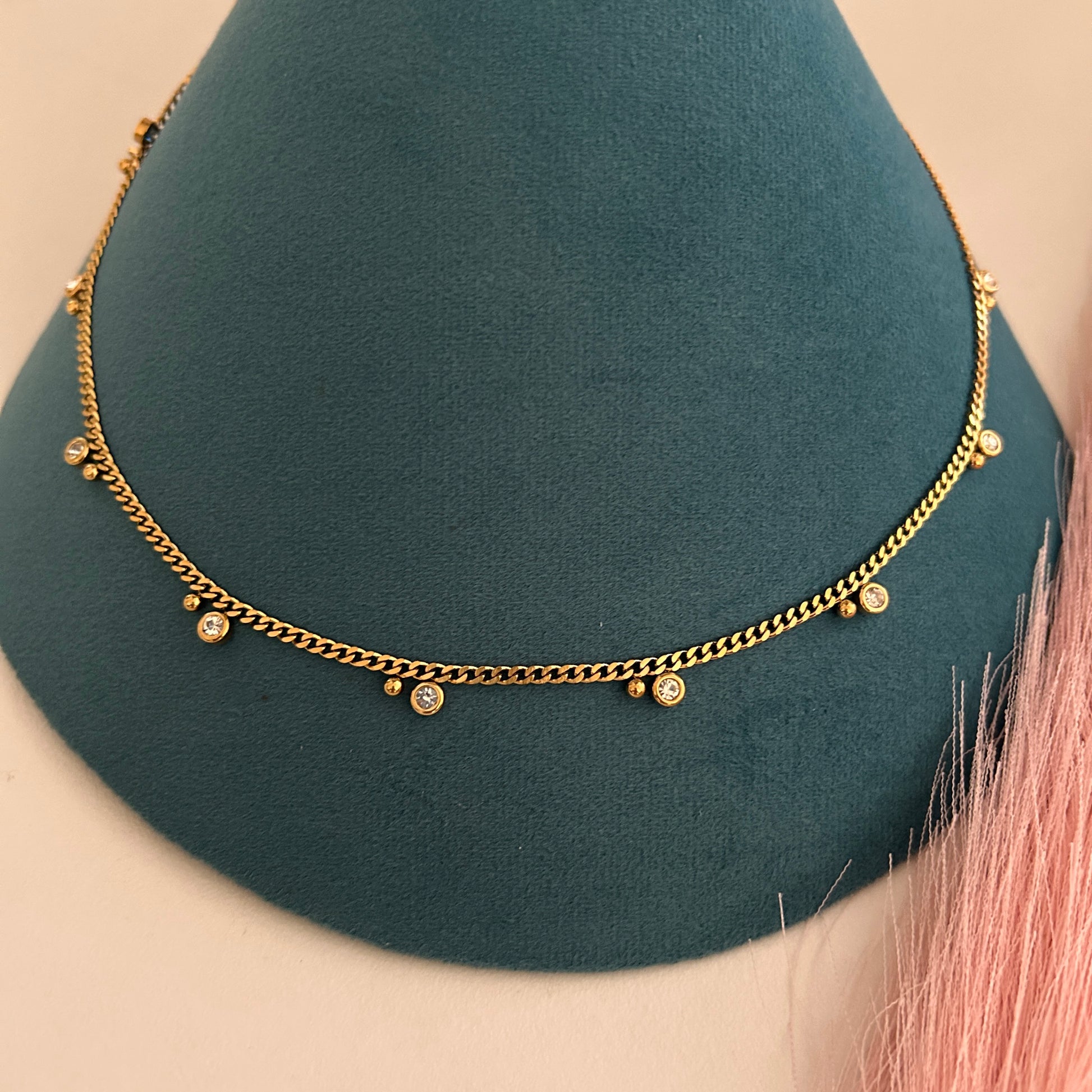 Gold waist band with evenly spaced crystal drop charms.