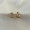 Modern gold hoops with dual curve and crystal detailing.