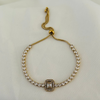 Gold bracelet with rectangular crystal design