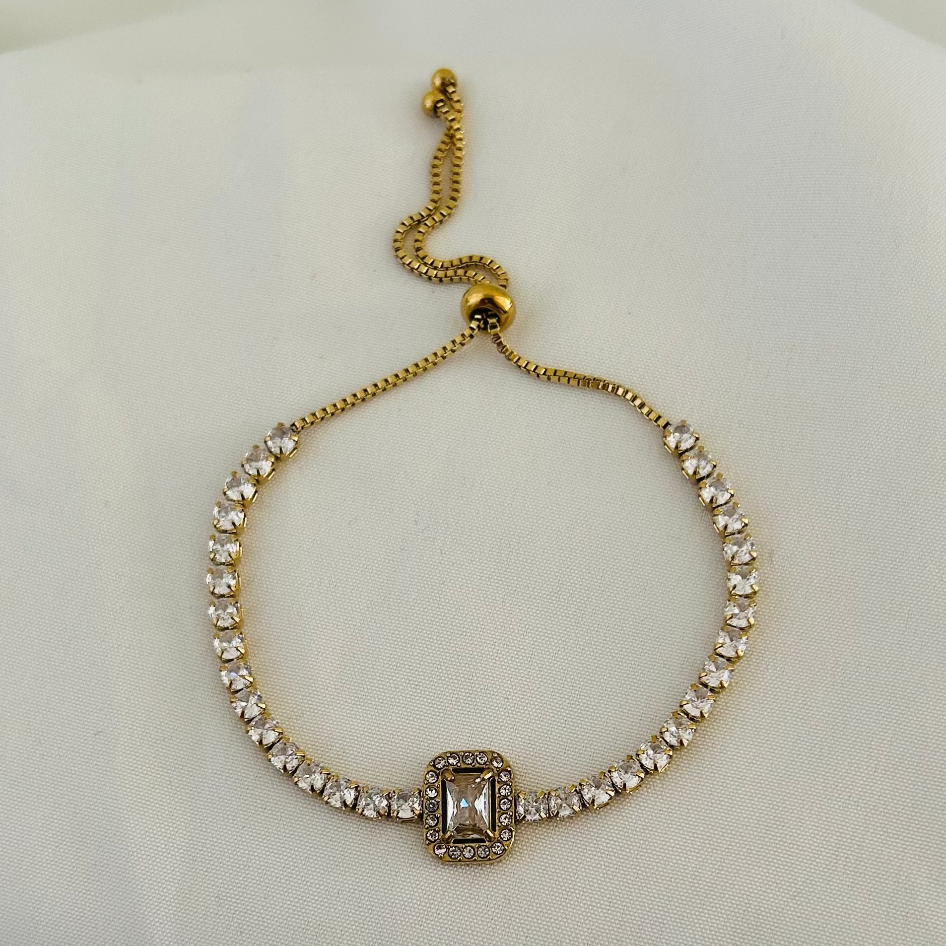 Gold bracelet with rectangular crystal design